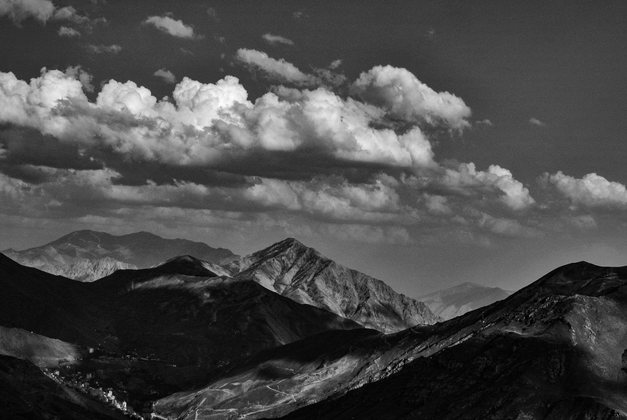 Mountain ridges under gathering clouds